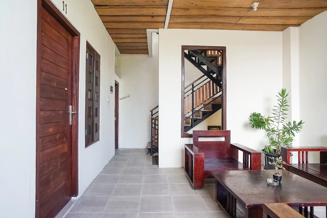 Pudi Homestay lobby area with stairs